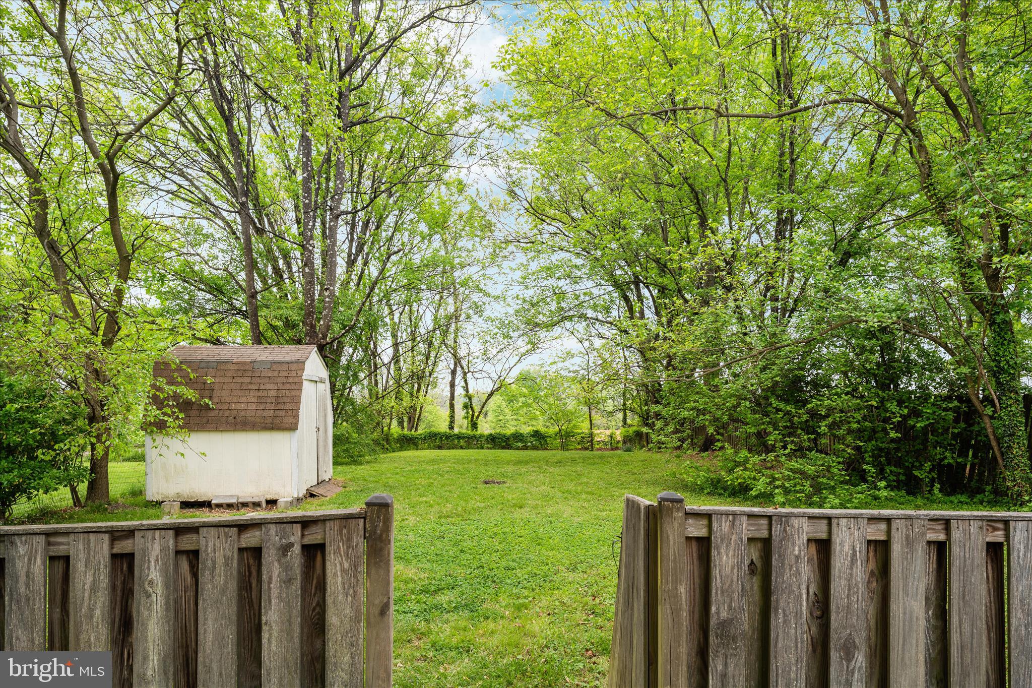 3961 Rectortown Road Marshall, VA 20115 - Photo 24 of 35 a view of backyard with wooden fence and trees