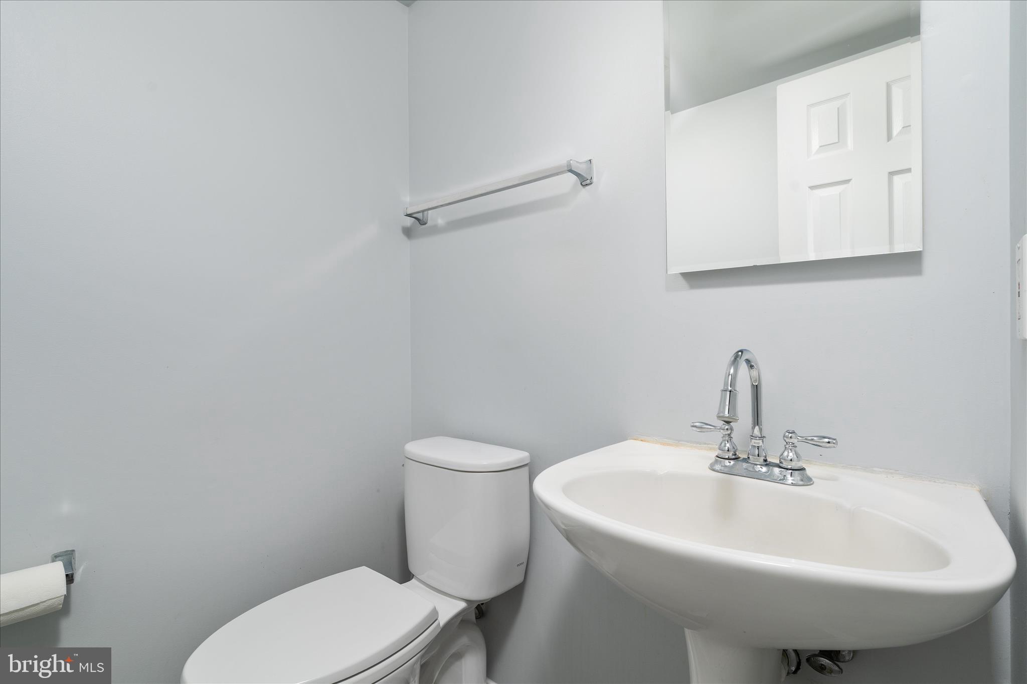 3961 Rectortown Road Marshall, VA 20115 - Photo 5 of 35 a bathroom with a sink a toilet and mirror