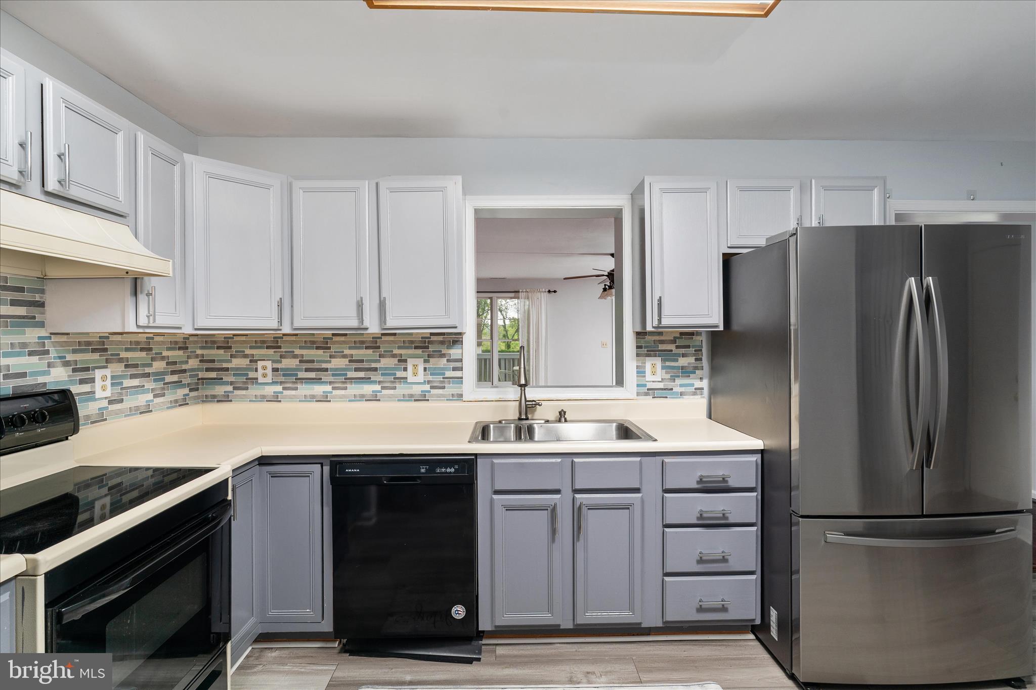 3961 Rectortown Road Marshall, VA 20115 - Photo 7 of 35 a kitchen with a sink stainless steel appliances and cabinets