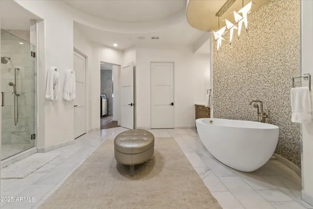 a roof deck with couches and potted plants with sky view