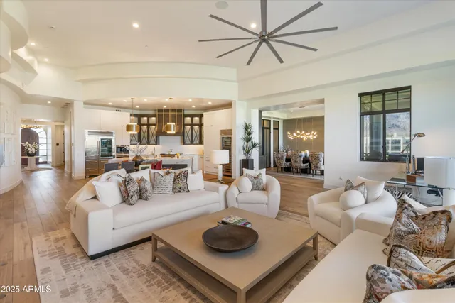 a view of a livingroom with furniture and a chandelier