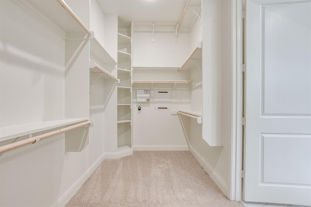 608 Tay Tay Way Springtown, TX 76082 - Photo 24 of 40 Walk-in closet extensive built-in shelving, and multiple hanging rods