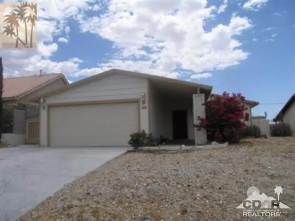 a view of a house with a yard and garage