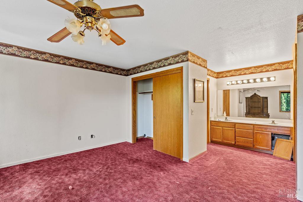 715 Placer Court Santa Rosa, CA 95401 - Photo 18 of 37 a view of a livingroom with an empty space and a ceiling fan