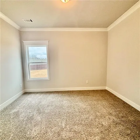 a view of a house with a garden and yard