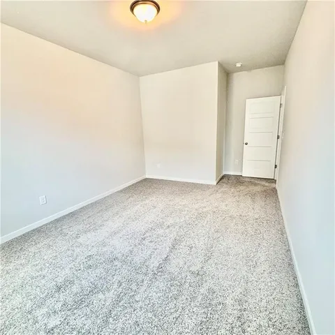 a front view of a house with a yard table and chairs