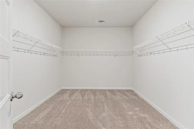 a view of a house with swimming pool and a yard