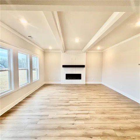 a front view of a house with a yard table and chairs