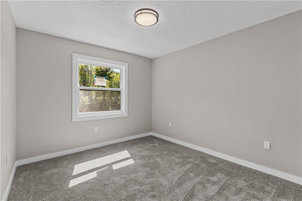 300 Gilkeson Road, Unit 10B Pittsburgh, PA 15228 - Photo 13 of 25 an empty room with windows