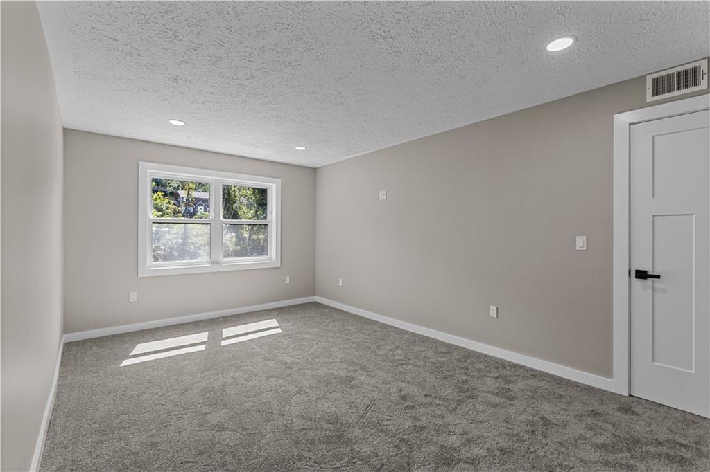 300 Gilkeson Road, Unit 10B Pittsburgh, PA 15228 - Photo 16 of 25 an empty room with windows