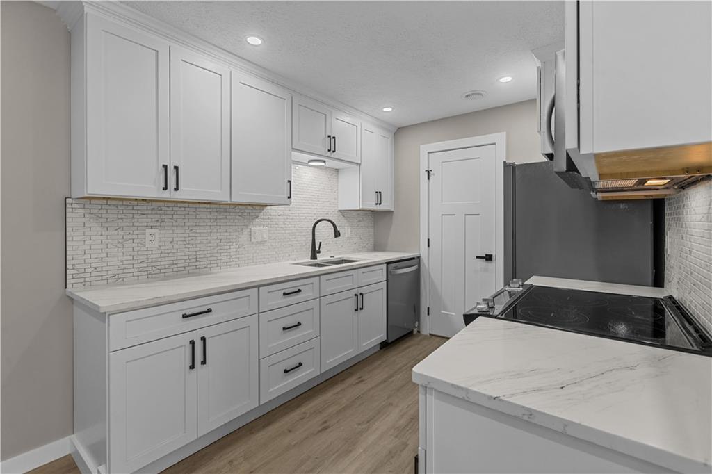 300 Gilkeson Road, Unit 10B Pittsburgh, PA 15228 - Photo 2 of 25 a kitchen with sink cabinets and stove