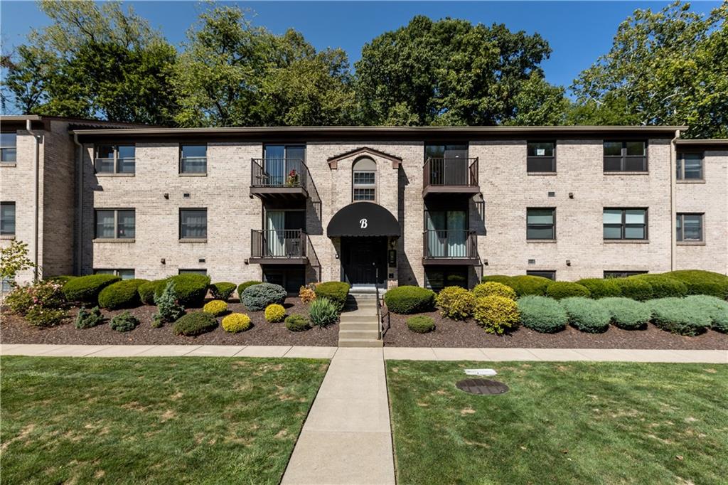 300 Gilkeson Road, Unit 10B Pittsburgh, PA 15228 - Photo 21 of 25 a front view of a house with garden