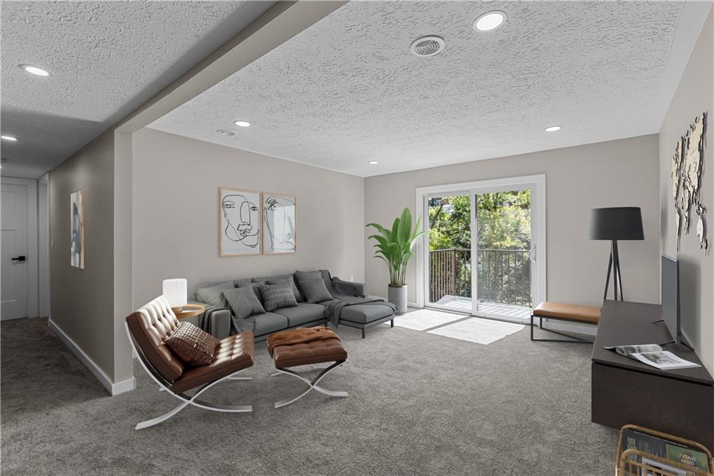 300 Gilkeson Road, Unit 10B Pittsburgh, PA 15228 - Photo 7 of 25 a living room with furniture and a flat screen tv