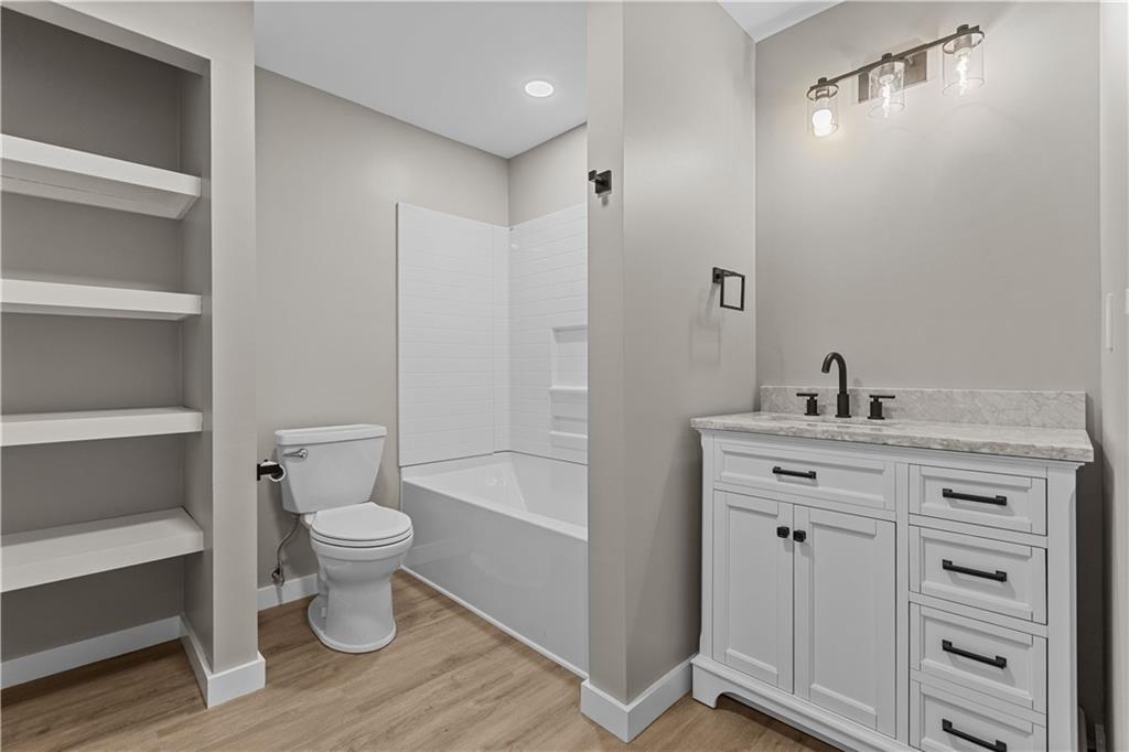300 Gilkeson Road, Unit 10B Pittsburgh, PA 15228 - Photo 10 of 25 a bathroom with a toilet a sink a mirror and vanity