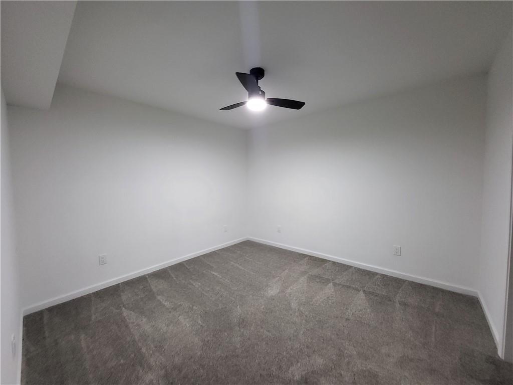 5729 Rock Road Union City, GA 30291 - Photo 13 of 17 an empty room with ceiling fan and window