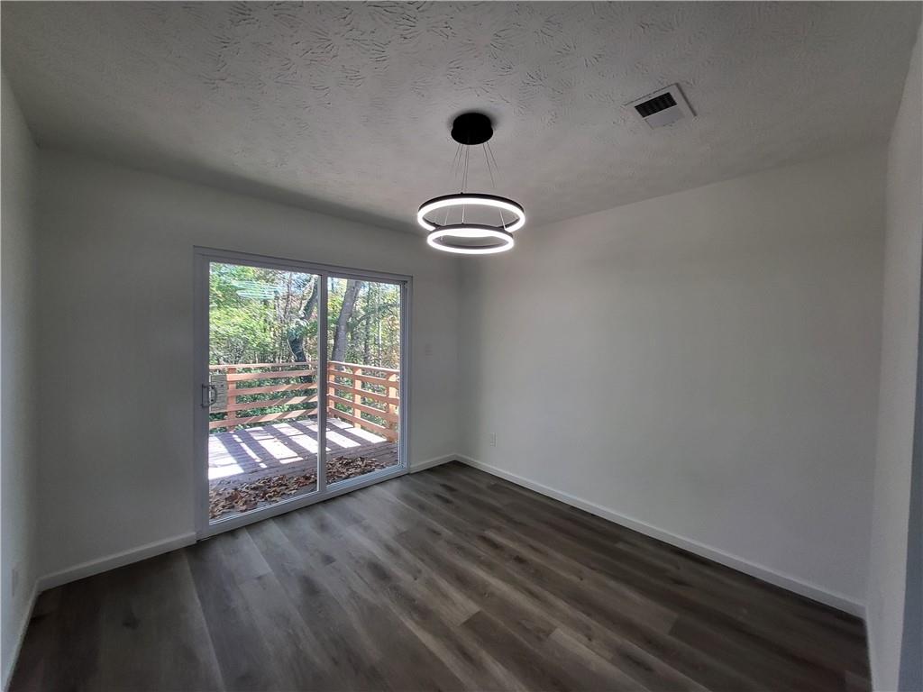 5729 Rock Road Union City, GA 30291 - Photo 5 of 17 an empty room with windows