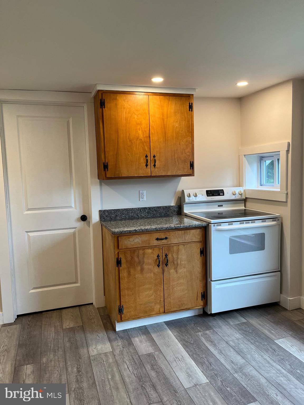 917 A A N Old Road, Unit 2 Strasburg, PA 17579 - Photo 1 of 7 a kitchen with stainless steel appliances granite countertop a stove a sink and a microwave