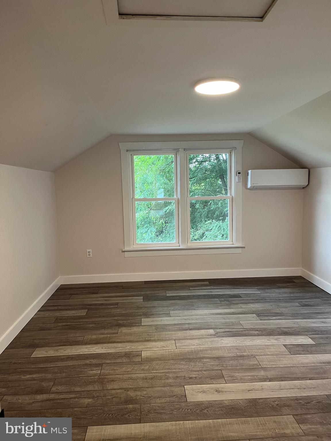 917 A A N Old Road, Unit 2 Strasburg, PA 17579 - Photo 6 of 7 a view of empty room with wooden floor and fan