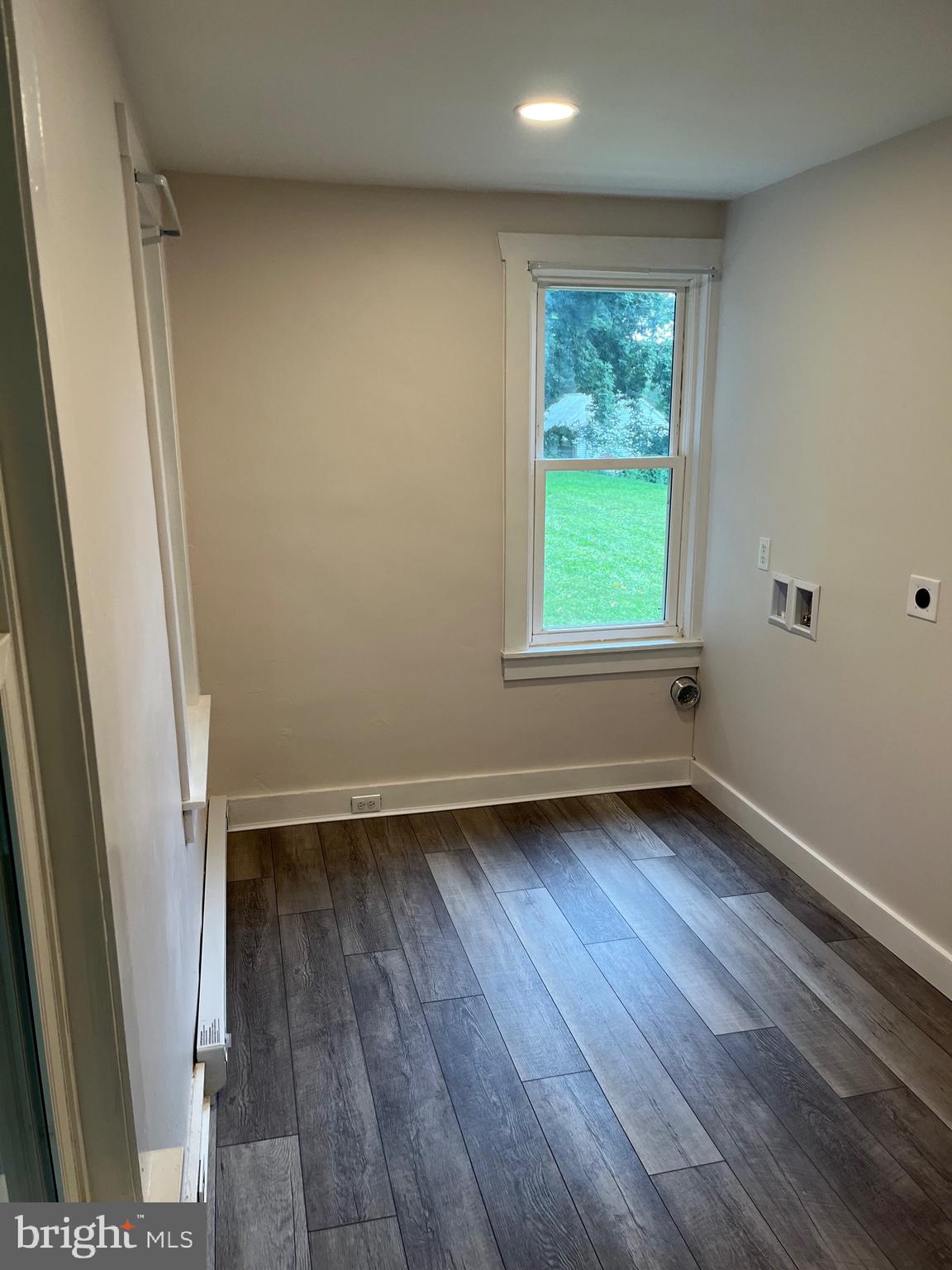 917 A A N Old Road, Unit 2 Strasburg, PA 17579 - Photo 7 of 7 an empty room with wooden floor and windows