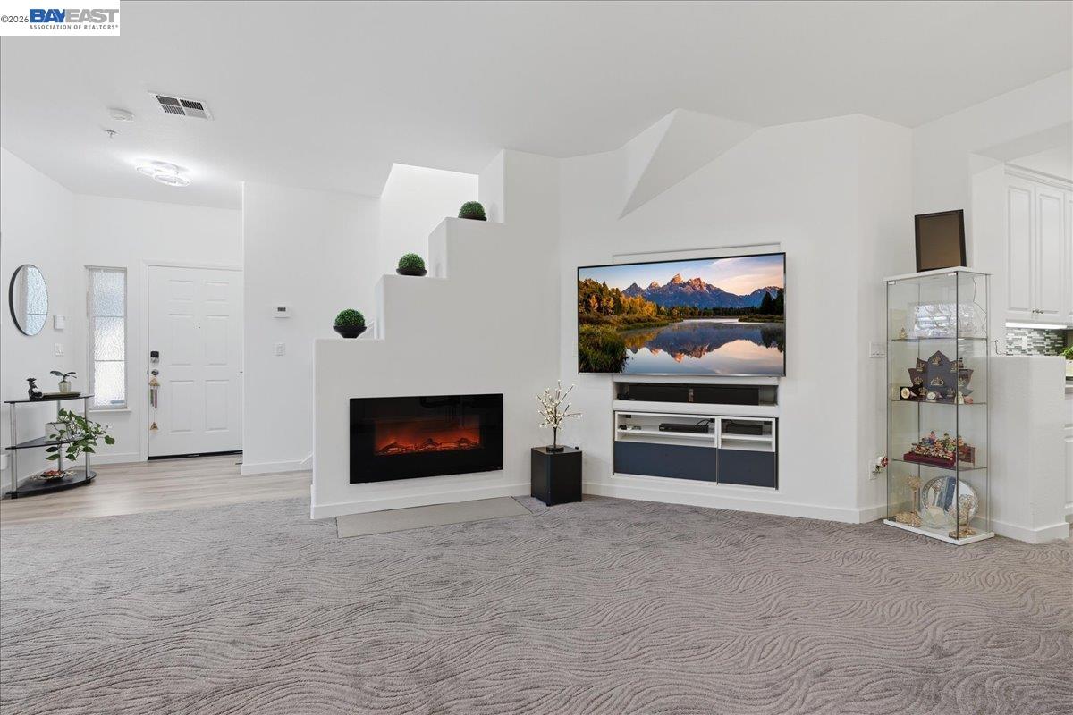 130 Sutter Creek Lane San Ramon, CA 94583 - Photo 12 of 56 a living room with furniture and a flat screen tv