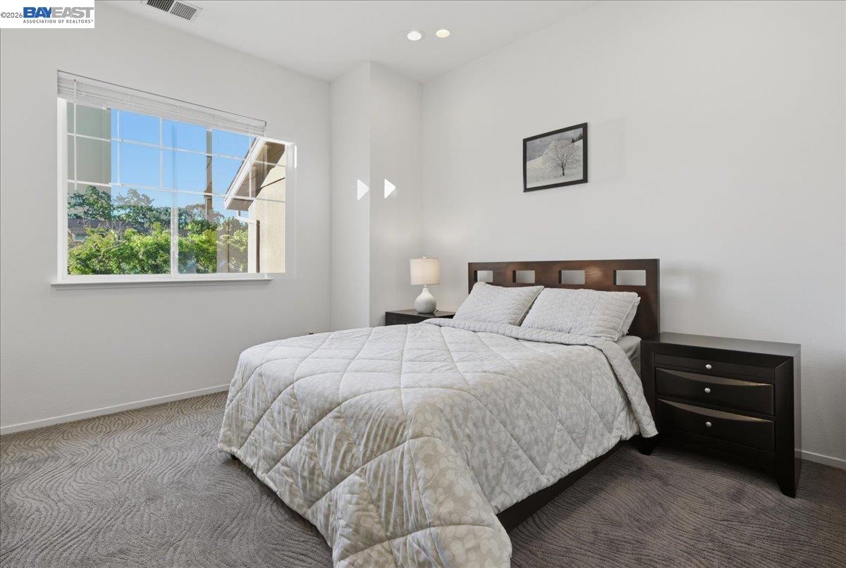 130 Sutter Creek Lane San Ramon, CA 94583 - Photo 24 of 56 a bedroom with a bed and a night stand