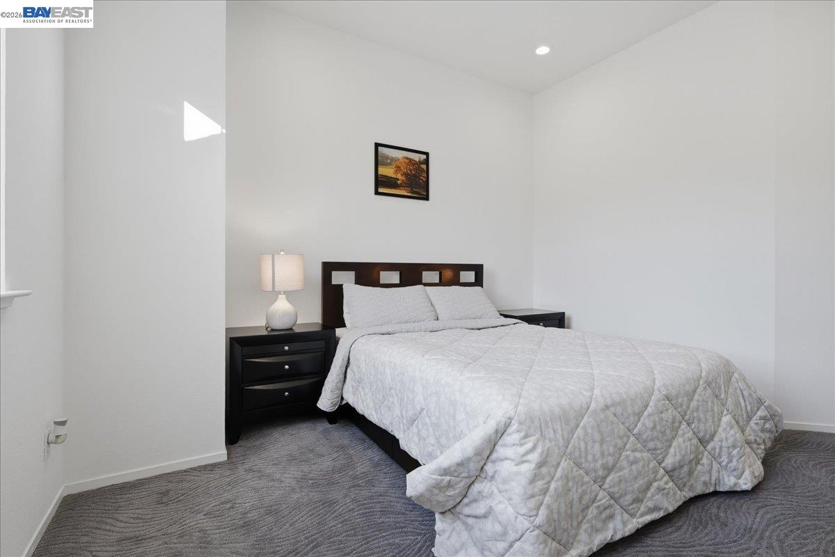 130 Sutter Creek Lane San Ramon, CA 94583 - Photo 25 of 56 a bedroom with a bed and a night stand