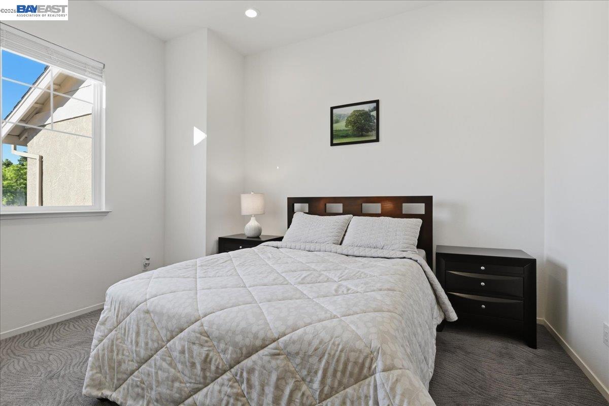 130 Sutter Creek Lane San Ramon, CA 94583 - Photo 27 of 56 a large bed sitting in a bedroom next to a window