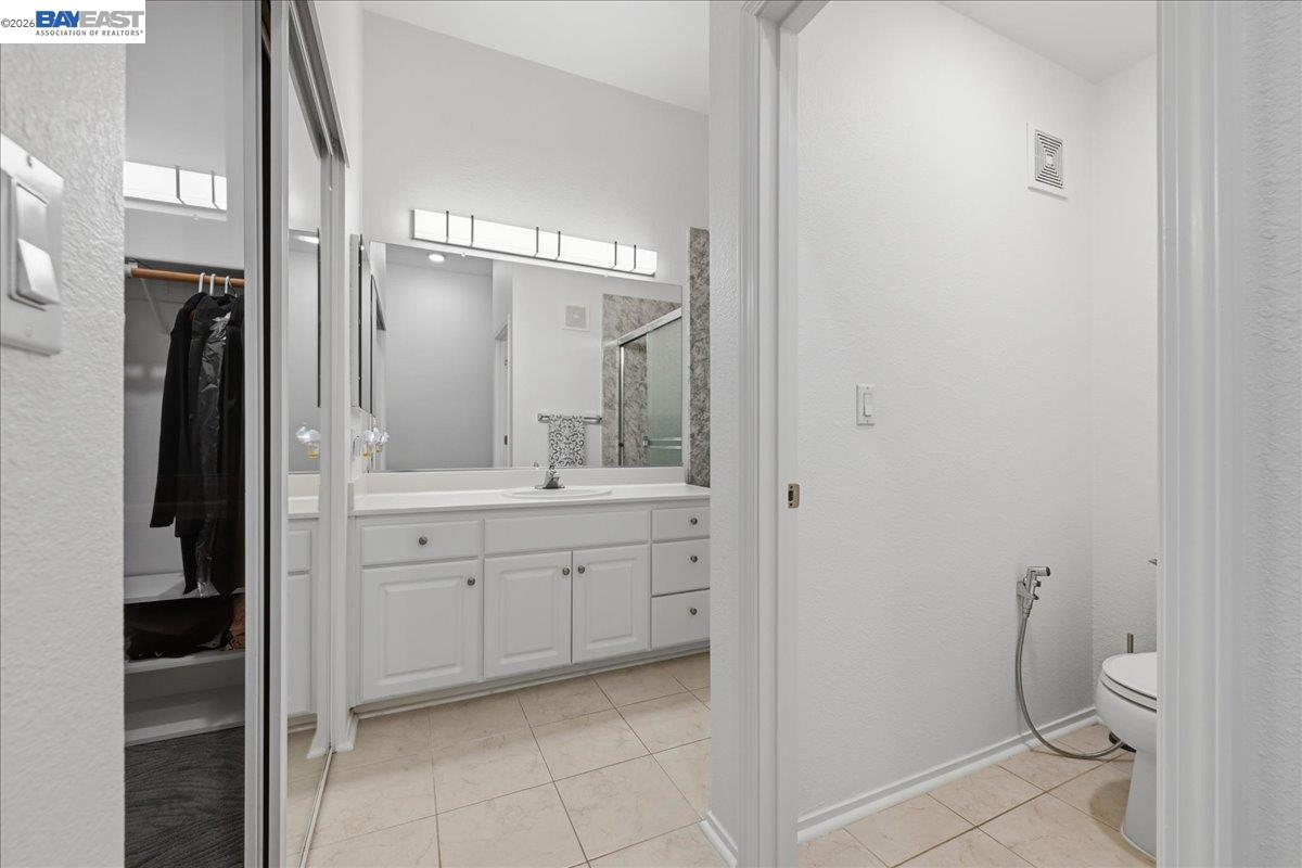 130 Sutter Creek Lane San Ramon, CA 94583 - Photo 28 of 56 a spacious bathroom with a granite countertop sink toilet and shower