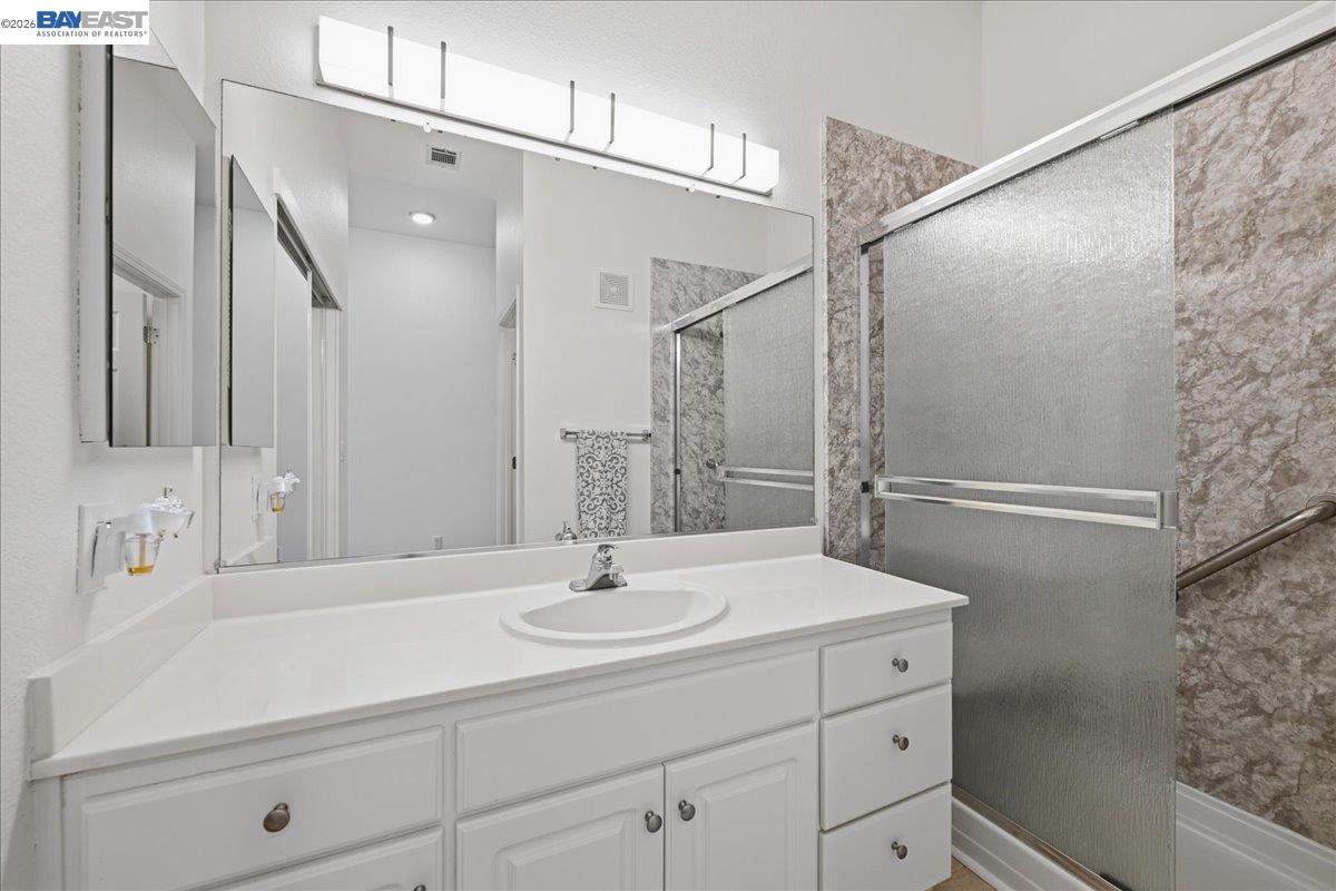 130 Sutter Creek Lane San Ramon, CA 94583 - Photo 29 of 56 a bathroom with a sink and mirror