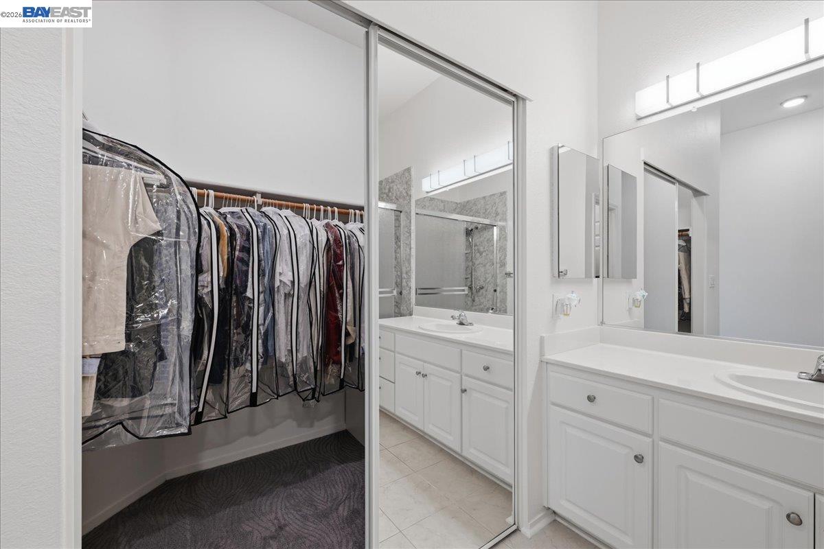 130 Sutter Creek Lane San Ramon, CA 94583 - Photo 32 of 56 a bathroom with a double vanity sink and mirror
