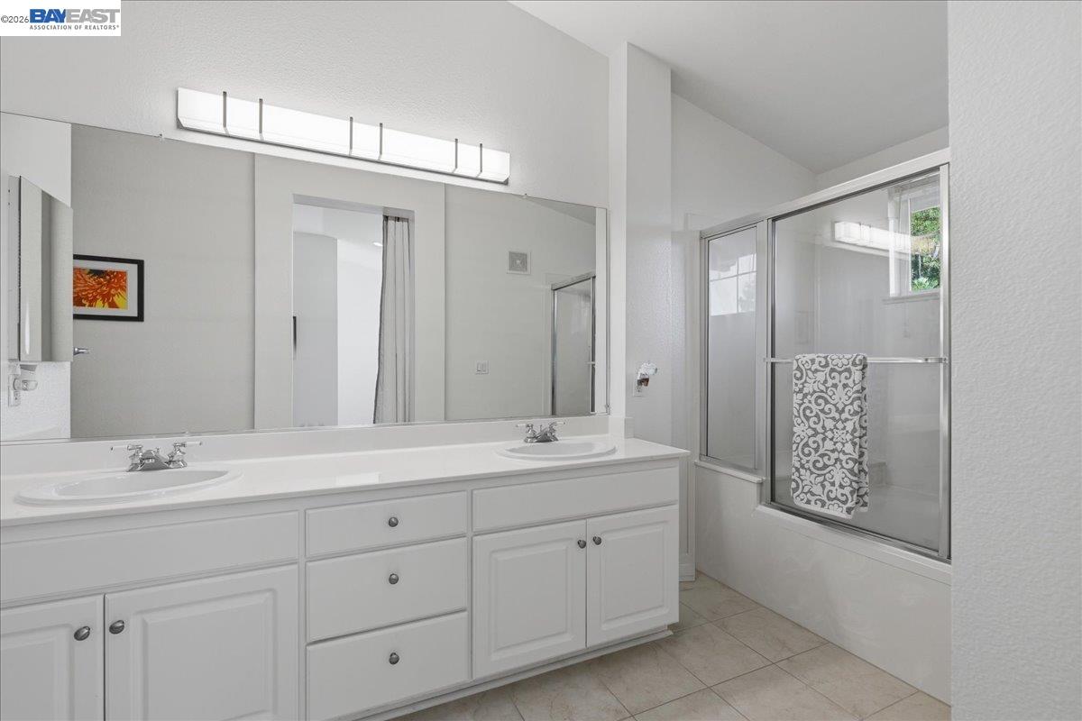 130 Sutter Creek Lane San Ramon, CA 94583 - Photo 38 of 56 a bathroom with double sink and a mirror