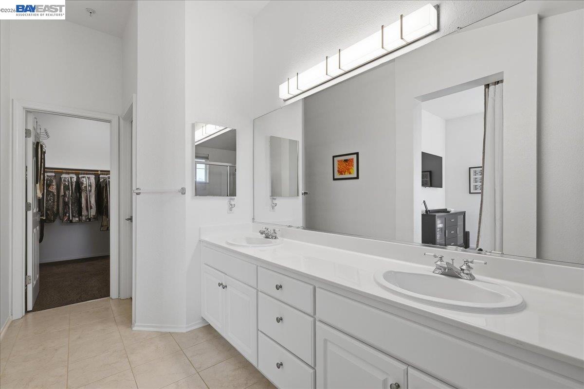 130 Sutter Creek Lane San Ramon, CA 94583 - Photo 40 of 56 a bathroom with a double vanity sink and mirror