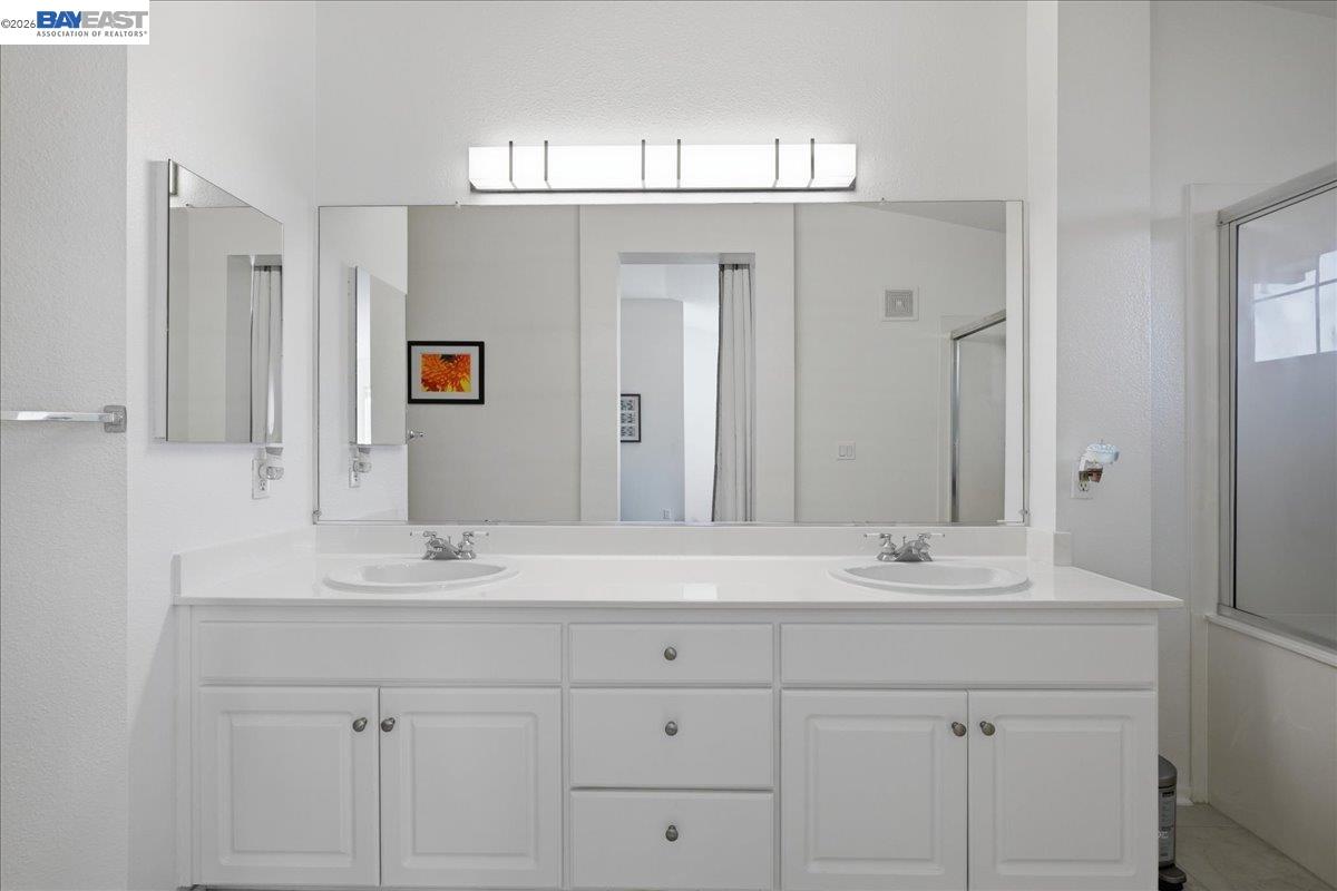 130 Sutter Creek Lane San Ramon, CA 94583 - Photo 41 of 56 a bathroom with a sink double vanity and a mirror