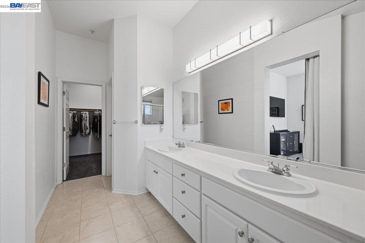 130 Sutter Creek Lane San Ramon, CA 94583 - Photo 43 of 56 a spacious bathroom with a double vanity sink and a mirror