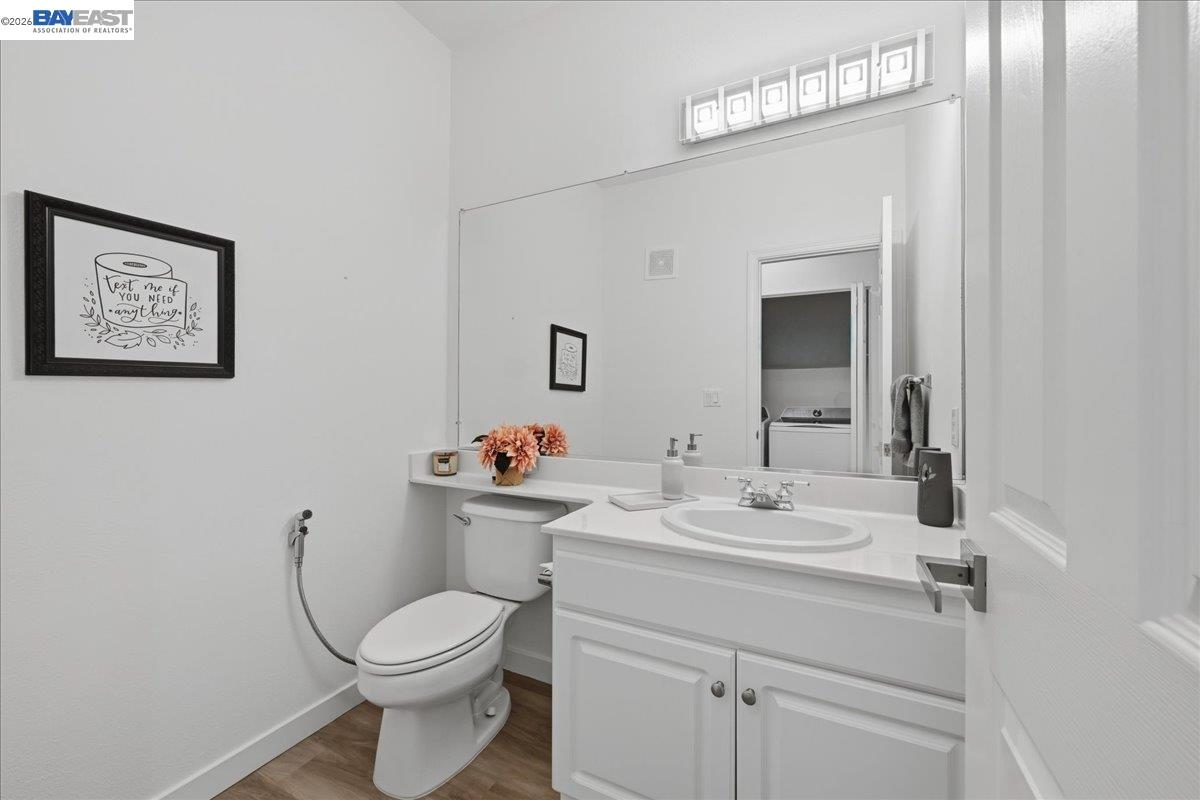 130 Sutter Creek Lane San Ramon, CA 94583 - Photo 44 of 56 a bathroom with a toilet sink and mirror