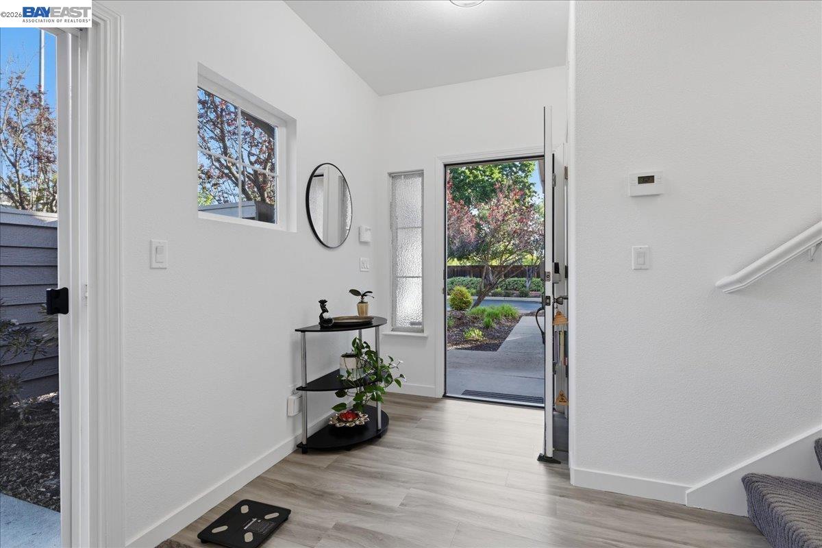 130 Sutter Creek Lane San Ramon, CA 94583 - Photo 7 of 56 a view of a room with wooden floor and windows
