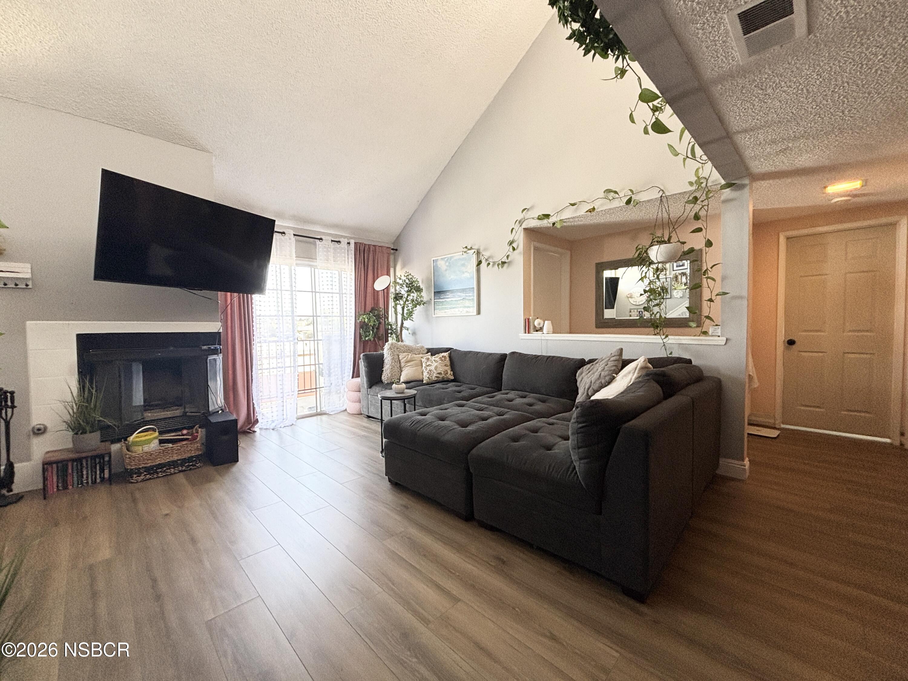 2409 Country Lane Santa Maria, CA 93455 - Photo 1 of 20 a living room with furniture and a fireplace