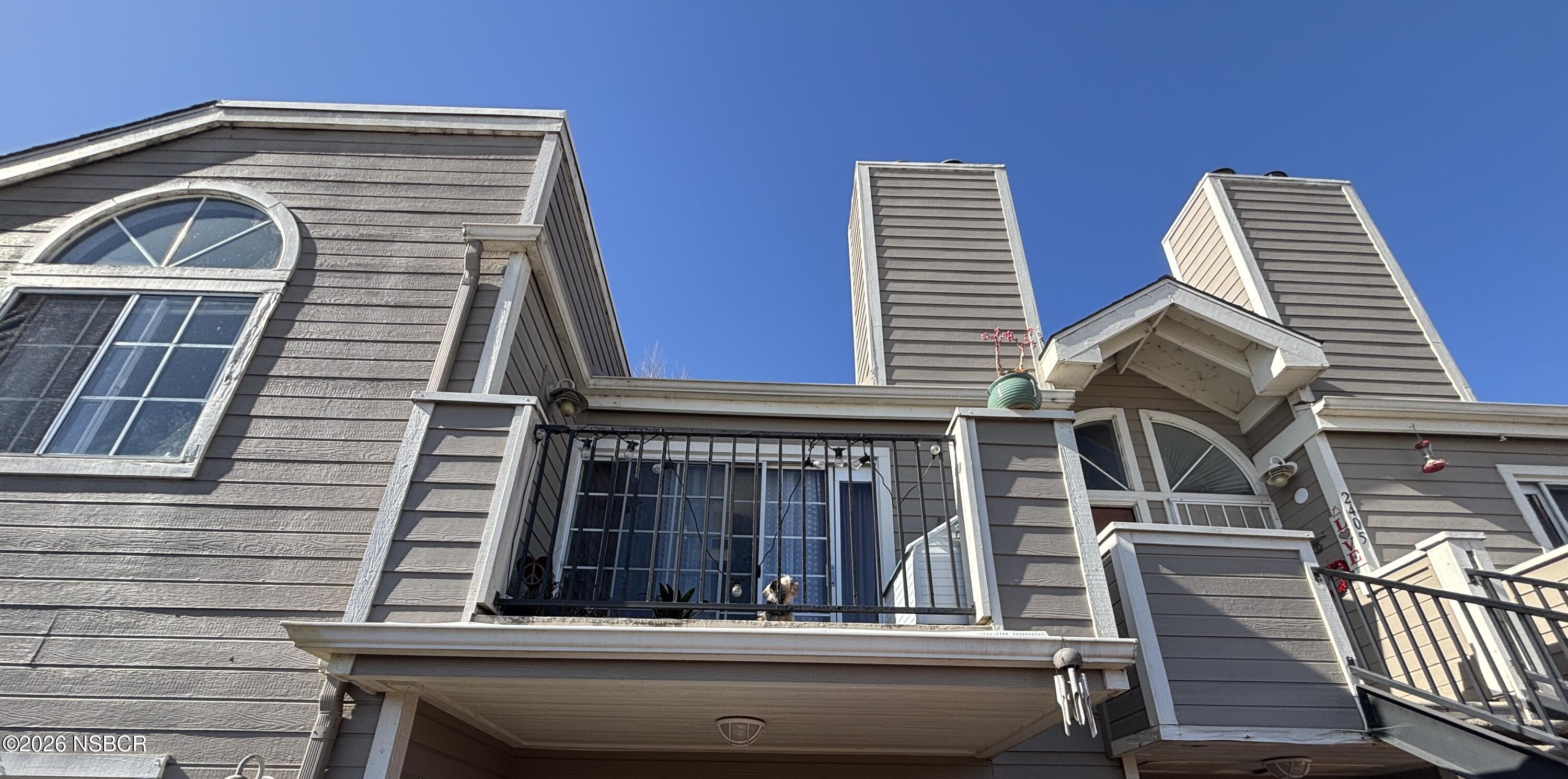 2409 Country Lane Santa Maria, CA 93455 - Photo 16 of 20 a view of house with a balcony and door