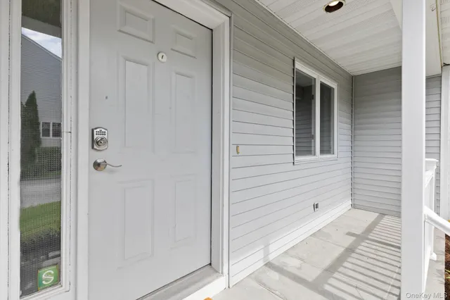 a view of a door and a window