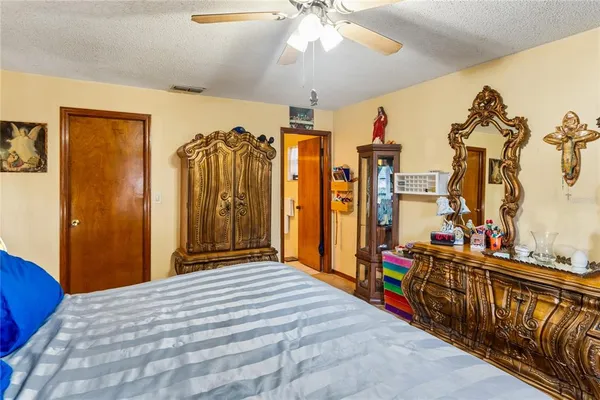 a bedroom with furniture and a chandelier