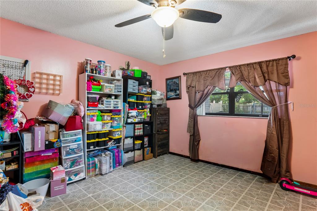 11122 Maderia Street Spring Hill, FL 34609 - Photo 26 of 49 a room with storage and utility