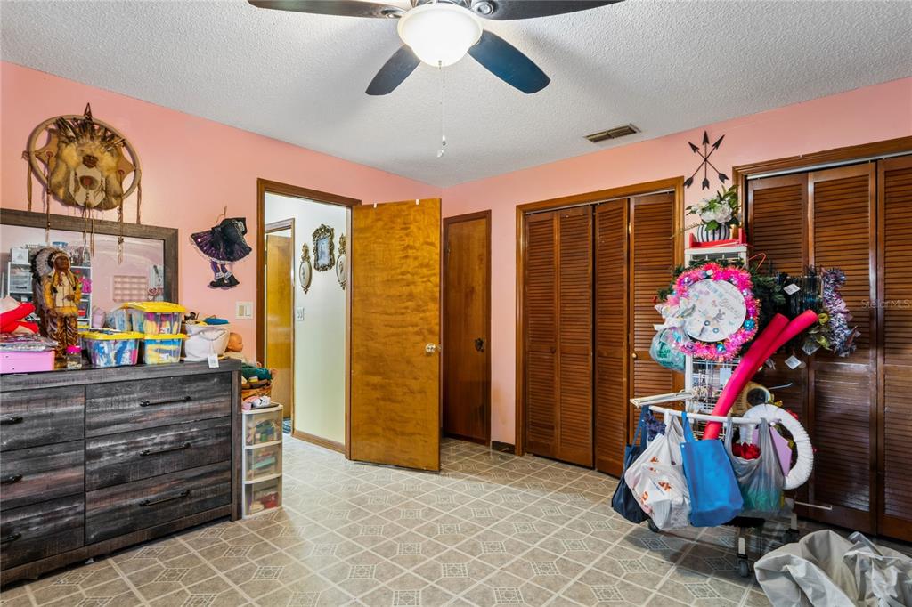 11122 Maderia Street Spring Hill, FL 34609 - Photo 27 of 49 a view of a room with shelves