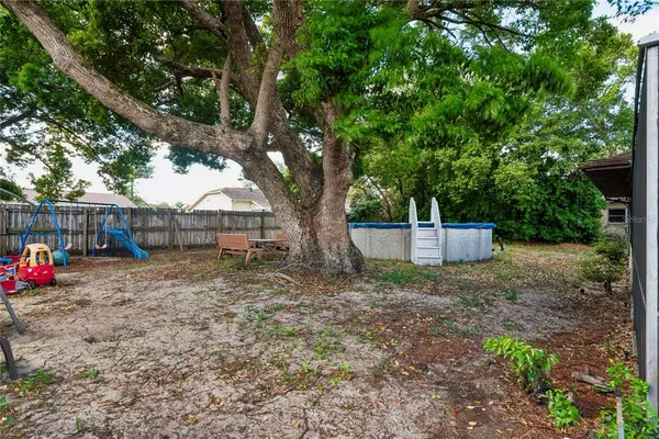 a view of house with backyard and entertaining space