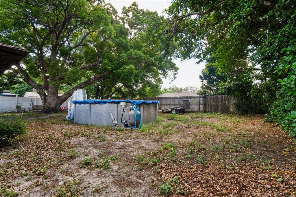 11122 Maderia Street Spring Hill, FL 34609 - Photo 39 of 49 a view of backyard with green space