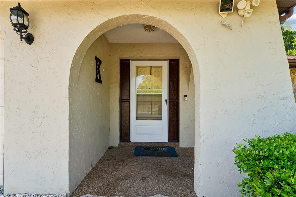 11122 Maderia Street Spring Hill, FL 34609 - Photo 4 of 49 a view of a entryway door of the house