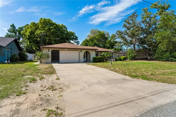 a house with yard in front of it