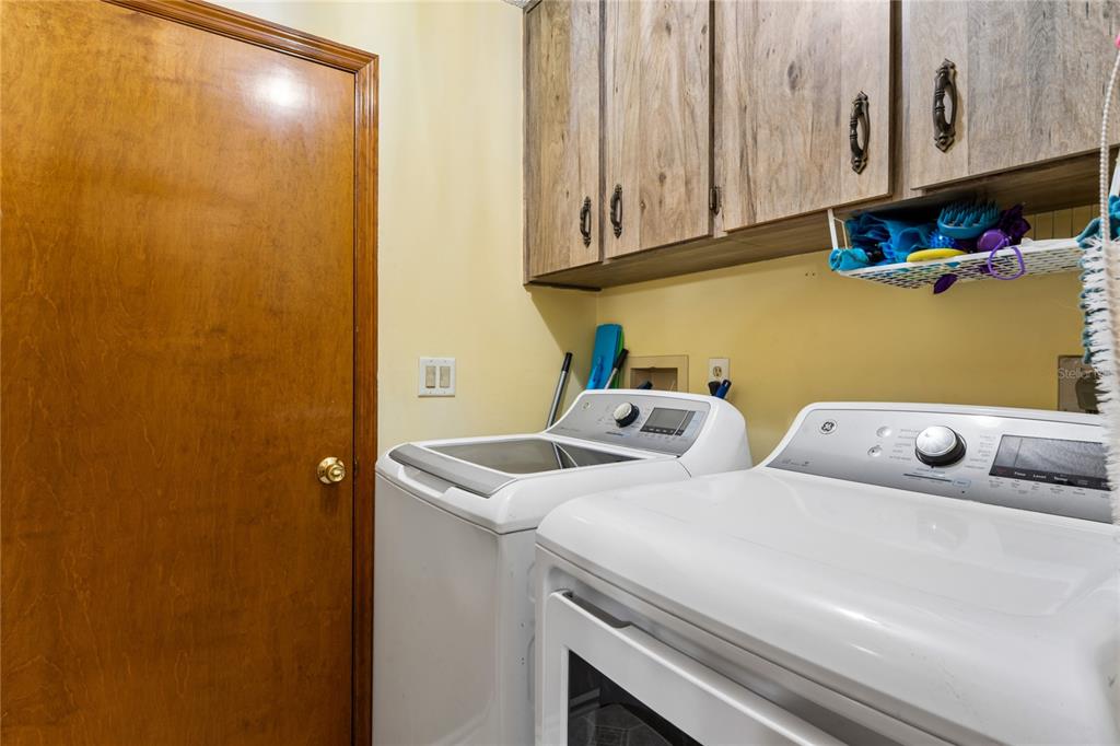 11122 Maderia Street Spring Hill, FL 34609 - Photo 43 of 49 a utility room with dryer and washer