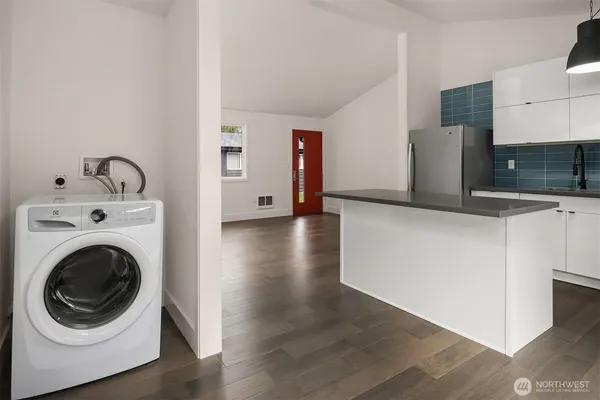 a view of a hallway with washer and dryer
