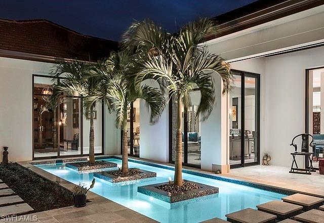 16767 Prato Way Naples, FL 34110 - Photo 2 of 2 a view of a lobby with black carpet