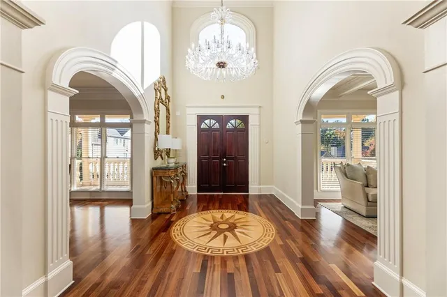 a kitchen with stainless steel appliances granite countertop sink stove and wooden cabinets